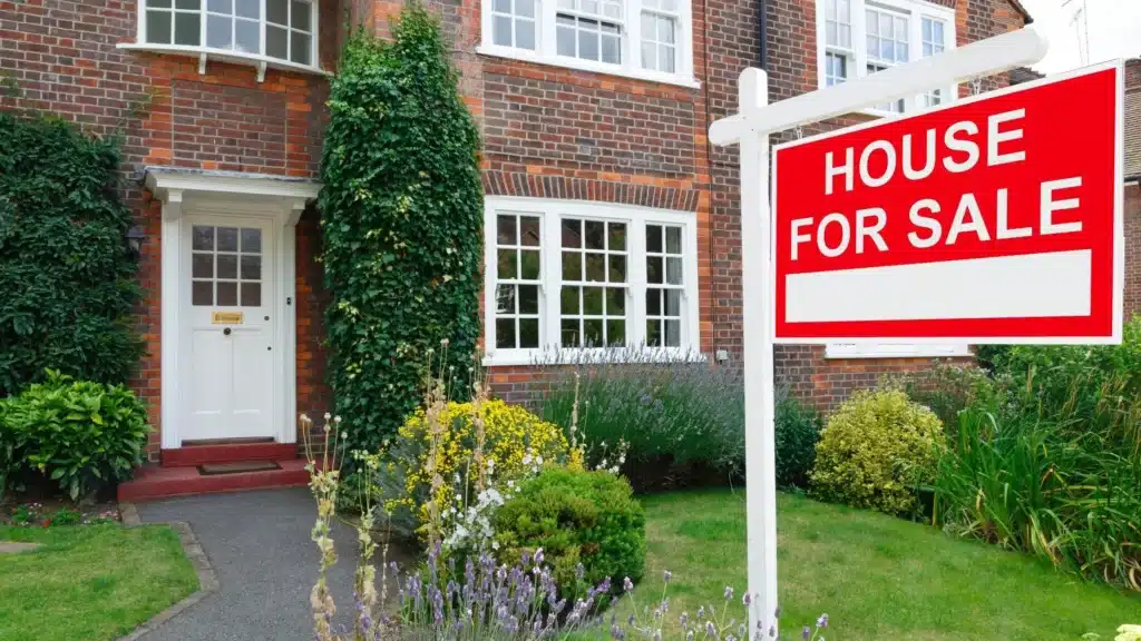 Home- with house for sale sign on front yard
