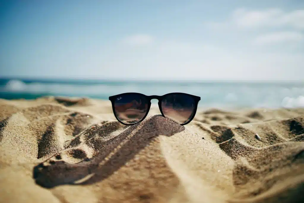 Stylish Sunglasses on a Sandy Beach